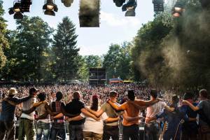 The Refugees with musician Heinz Ratz greet the public from stage after a concert