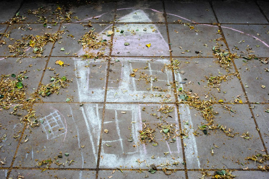 Painted house from child on a pavement in Berlin